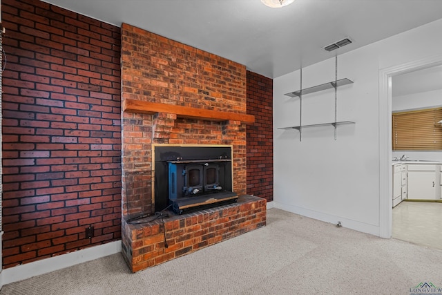 carpeted living room with a wood stove