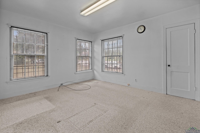 unfurnished room featuring carpet flooring