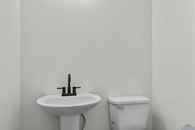1001 Akin Dr, Longview, TX 75602 - half bath with a sink and toilet