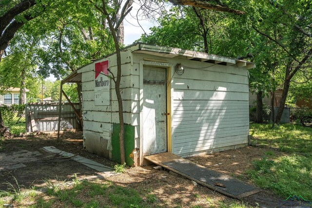 view of shed with fence