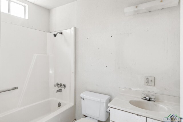 bathroom with vanity, shower / bathing tub combination, and toilet