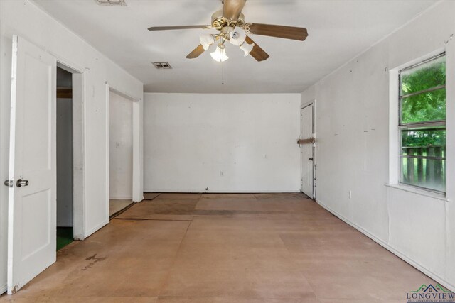 spare room with a ceiling fan and visible vents