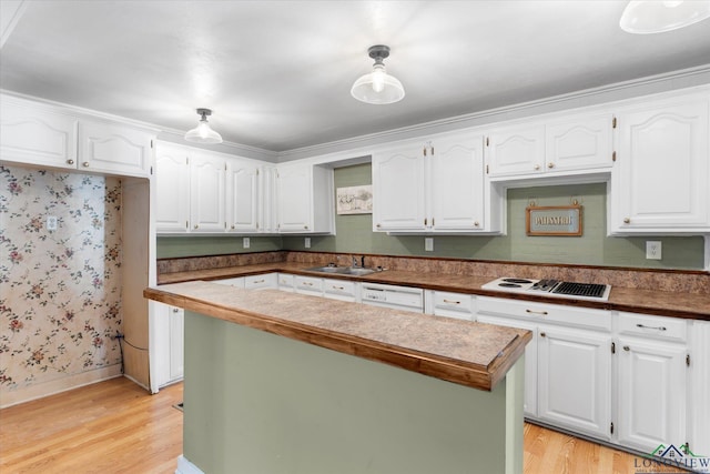 kitchen featuring a center island, white appliances, sink, light wood-type flooring, and white cabinetry