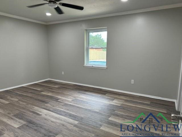 unfurnished room with baseboards, crown molding, a ceiling fan, and wood finished floors