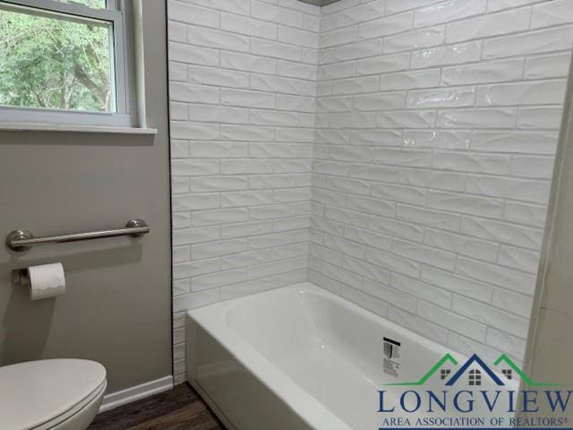 bathroom featuring hardwood / wood-style flooring and toilet