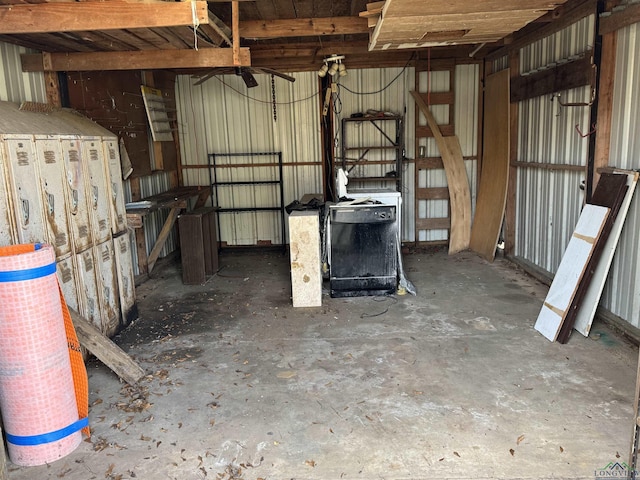 interior space with a ceiling fan and metal wall