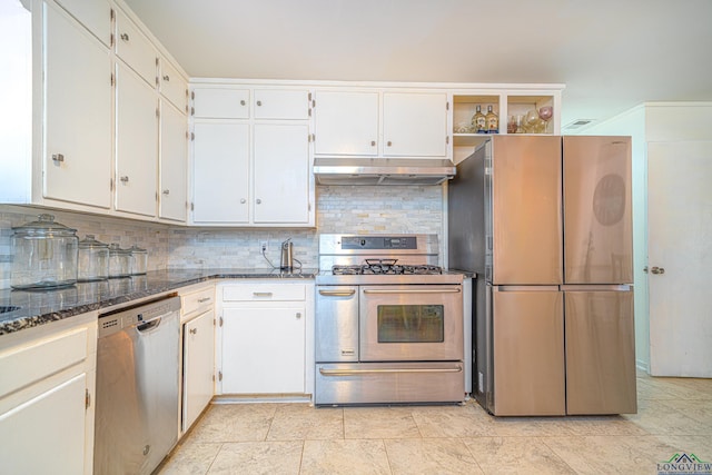 2215 Redbud, Kilgore, TX 75662 - kitchen featuring stainless steel appliances, under cabinet range hood, backsplash, white cabinets, and dark stone counters