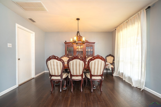 2215 Redbud, Kilgore, TX 75662 - dining area with a chandelier and dark wood-type flooring