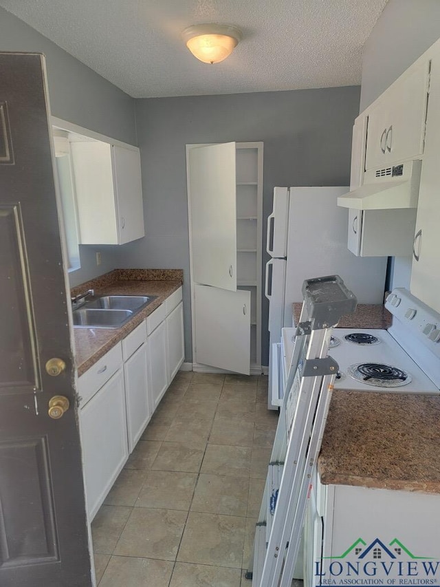 kitchen with white cabinetry, sink, white electric range, and a textured ceiling