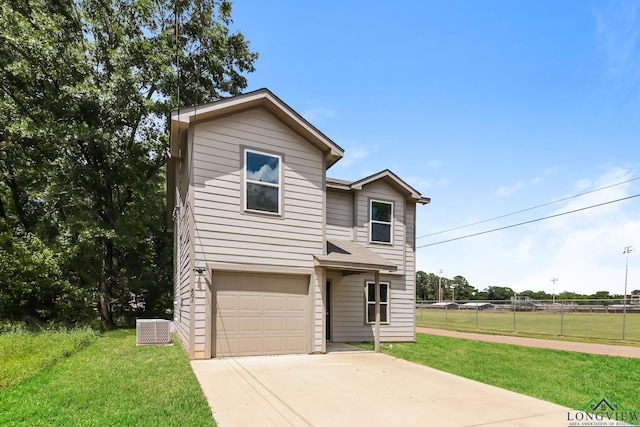 801 W Walnut St, Longview, TX 75601 - traditional-style home featuring central AC unit, a garage, and concrete driveway