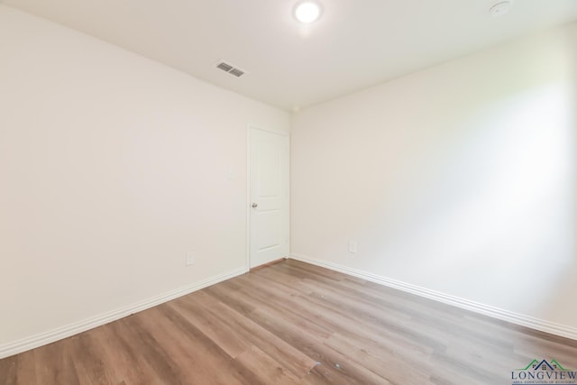 801 W Walnut St, Longview, TX 75601 - empty room featuring light wood-style flooring and baseboards