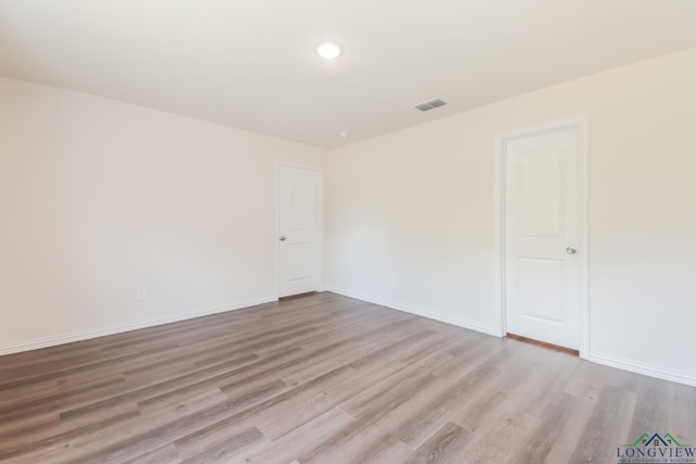 801 W Walnut St, Longview, TX 75601 - unfurnished room featuring wood finished floors and baseboards