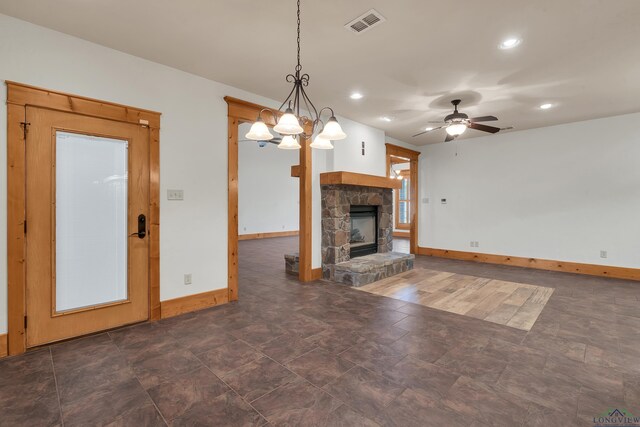 kitchen featuring tasteful backsplash, hanging light fixtures, stone counters, and appliances with stainless steel finishes