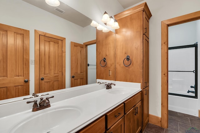 bathroom featuring vanity, tile patterned floors, and bathing tub / shower combination