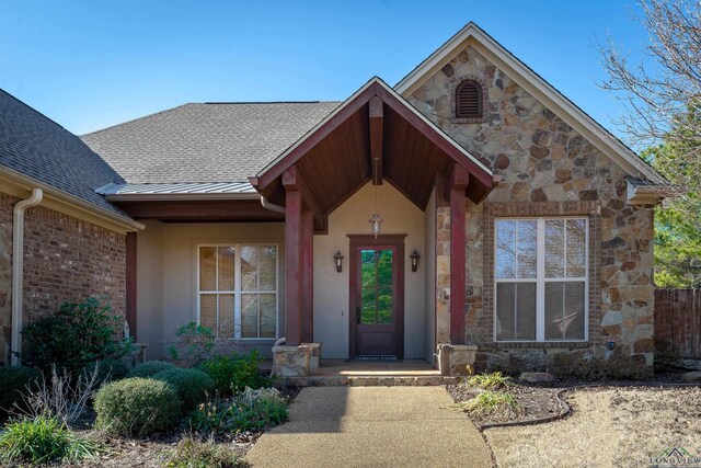 entrance to property with a patio area and ceiling fan