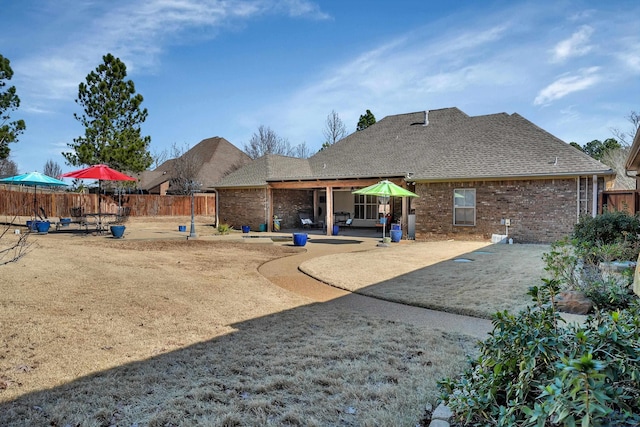 rear view of property featuring a patio area