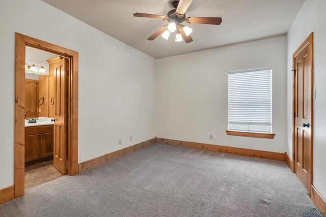 unfurnished living room featuring ceiling fan and a fireplace