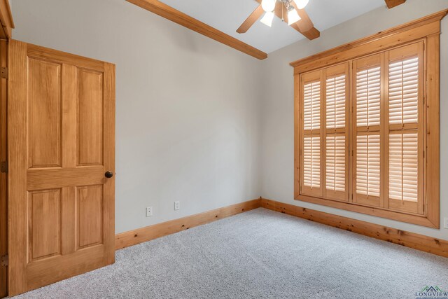 unfurnished bedroom featuring light carpet, sink, ensuite bath, and ceiling fan