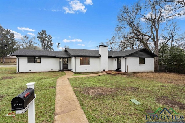 ranch-style home with a front lawn