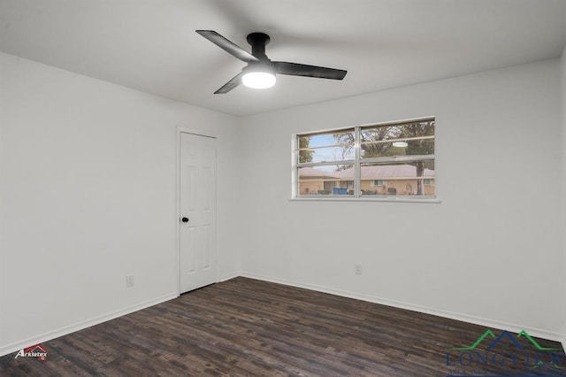 empty room featuring ceiling fan and dark hardwood / wood-style flooring