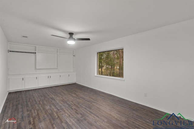 unfurnished bedroom with ceiling fan and dark hardwood / wood-style floors