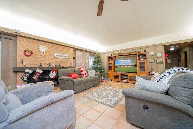 tiled living room with ceiling fan