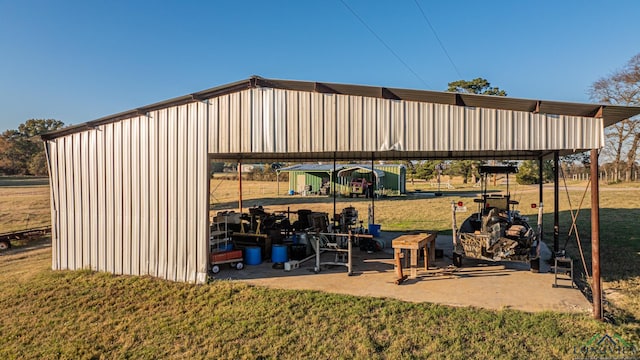 view of outbuilding with a yard