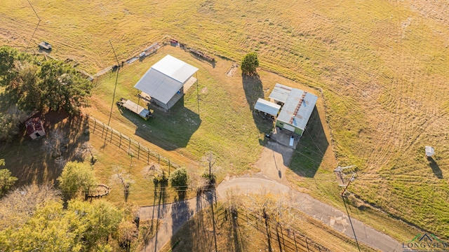 birds eye view of property with a rural view