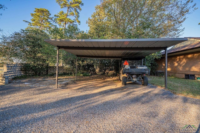 view of parking / parking lot featuring a carport