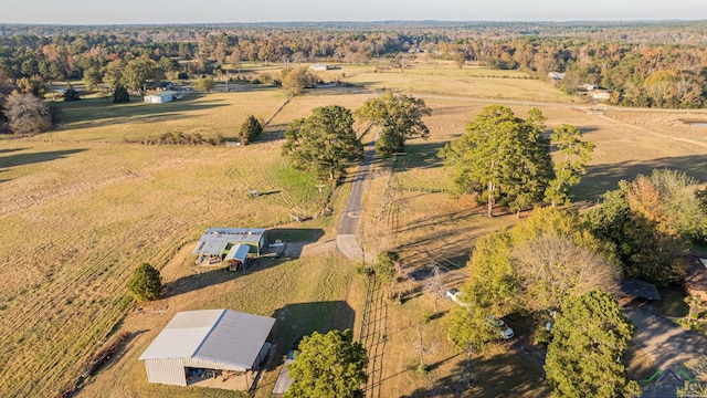 birds eye view of property with a rural view