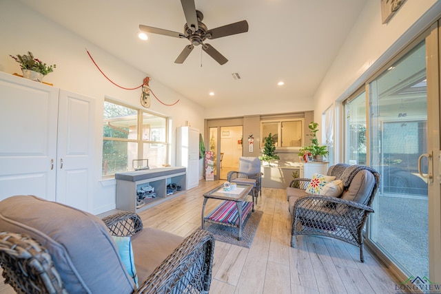 living room featuring ceiling fan and light hardwood / wood-style floors