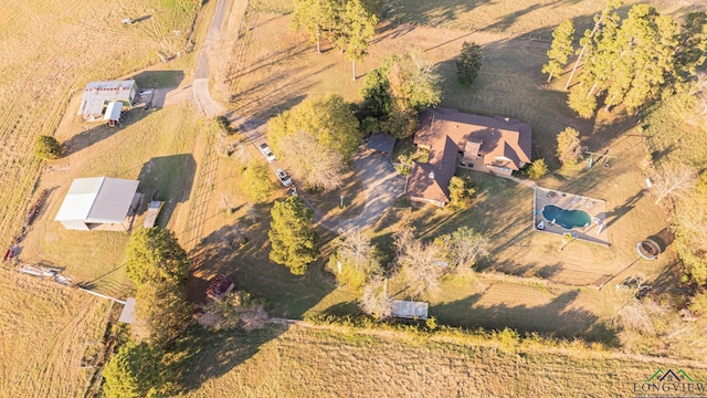 birds eye view of property with a rural view