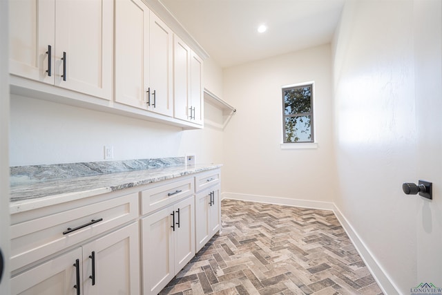 washroom featuring cabinets