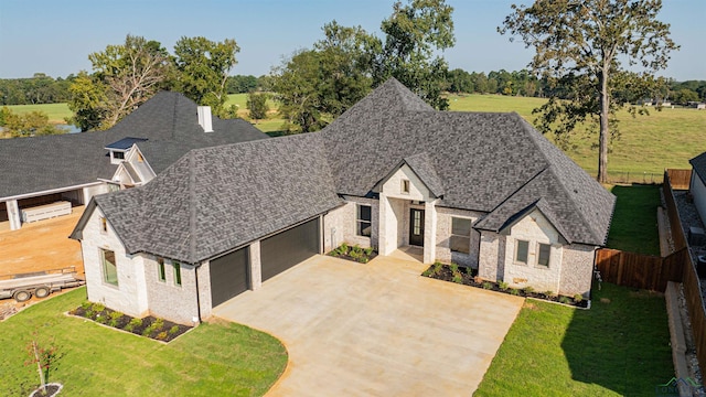 view of front facade featuring a front yard and a garage