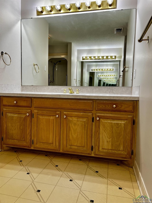 bathroom featuring vanity and tile patterned floors