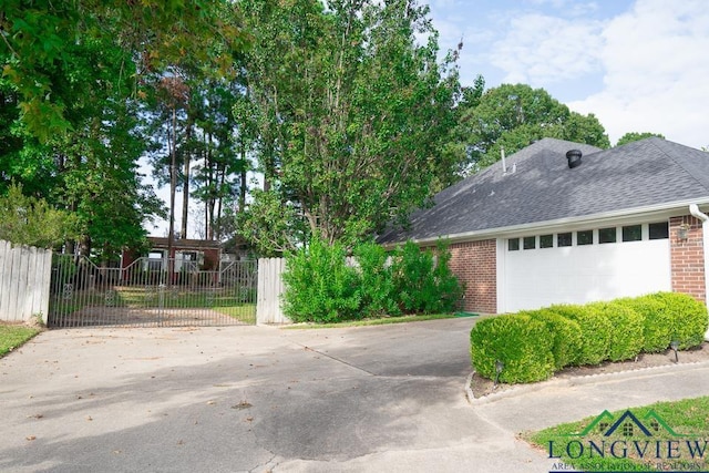 view of side of property with a garage