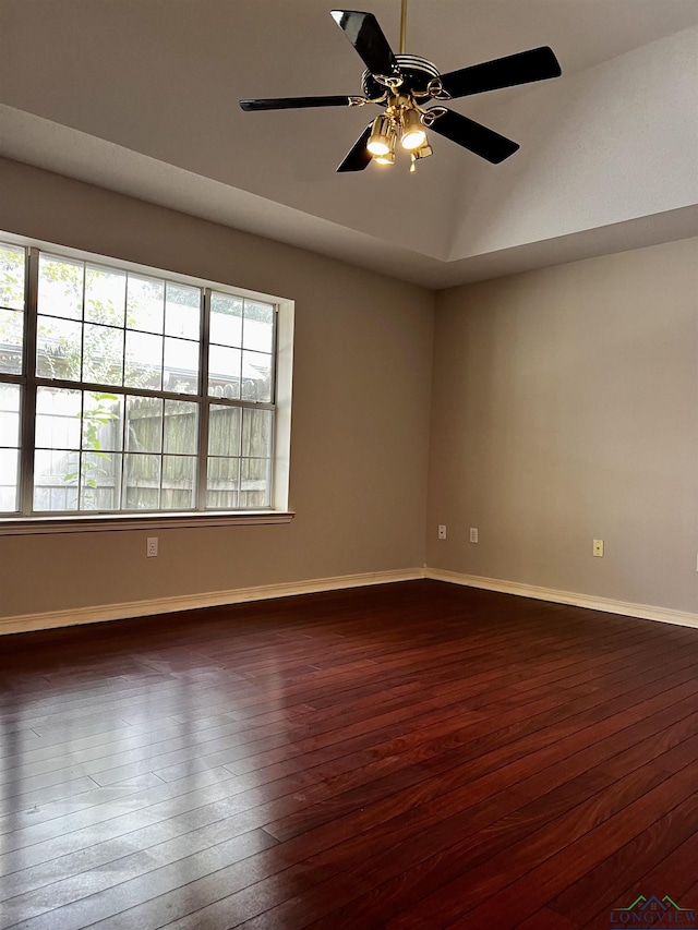 unfurnished room with ceiling fan and dark hardwood / wood-style flooring