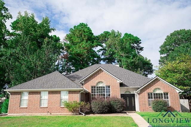 view of front of home with a front lawn