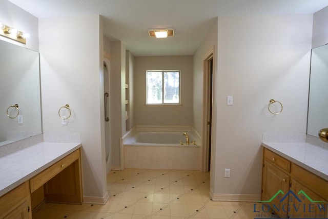 bathroom with vanity and a bath