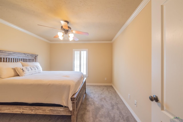 carpeted bedroom with ceiling fan and ornamental molding