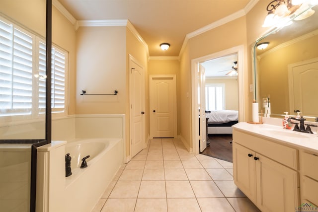 bathroom featuring vanity, ceiling fan, crown molding, tile patterned flooring, and a bathing tub