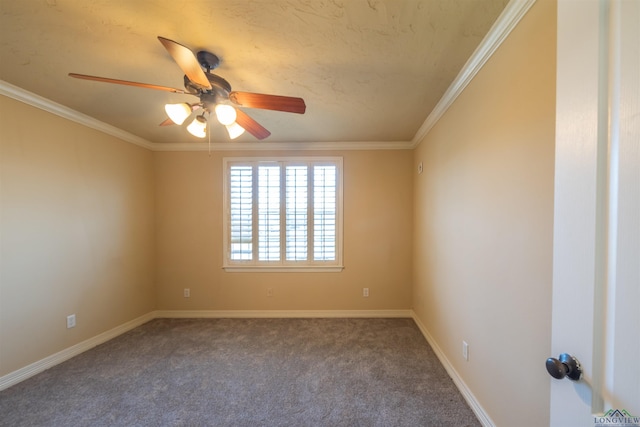 carpeted spare room featuring ceiling fan and crown molding