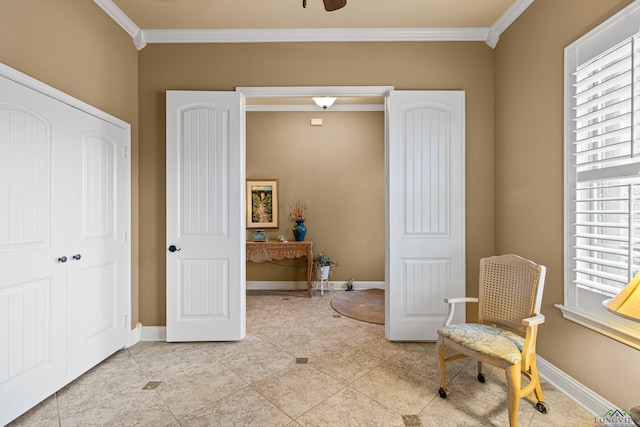 sitting room featuring light tile patterned floors and crown molding