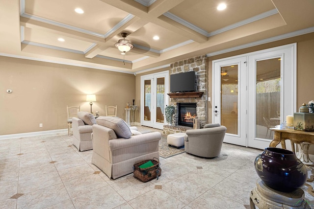 living room with coffered ceiling, a stone fireplace, crown molding, ceiling fan, and beam ceiling