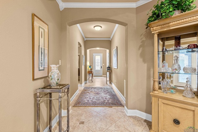 corridor with light tile patterned flooring and ornamental molding