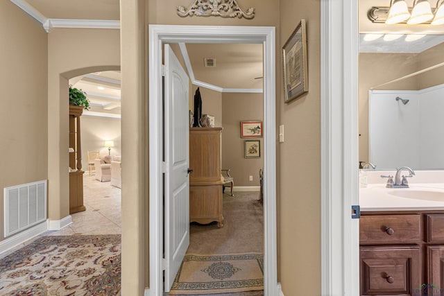 bathroom featuring vanity and ornamental molding