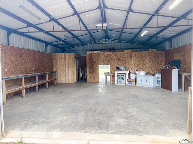 garage featuring wooden walls