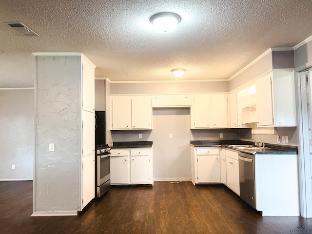 kitchen featuring sink, dark hardwood / wood-style floors, crown molding, white cabinets, and appliances with stainless steel finishes