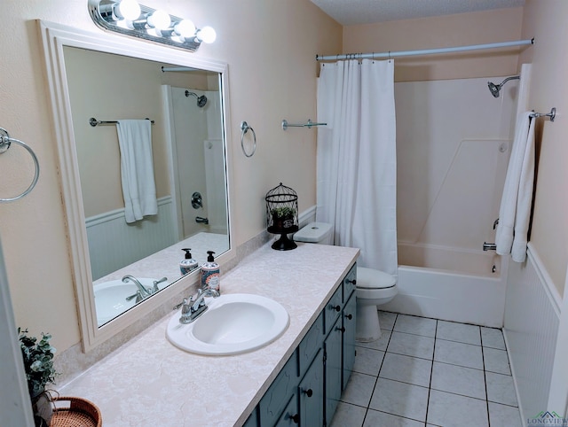 bathroom featuring vanity, toilet, tile patterned floors, and shower / bath combination with curtain