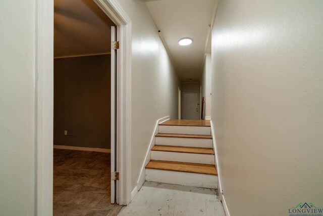 601 Wood St, Gladewater, TX 75647 - staircase featuring baseboards and recessed lighting